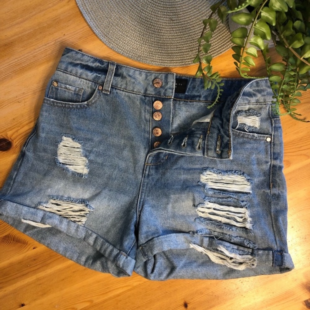 Celebrity pink light wash ripped denim shorts